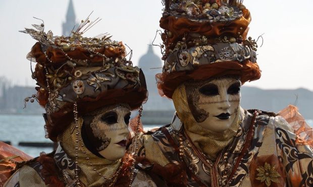 Two masked figures on the Riva degli Schiavoni